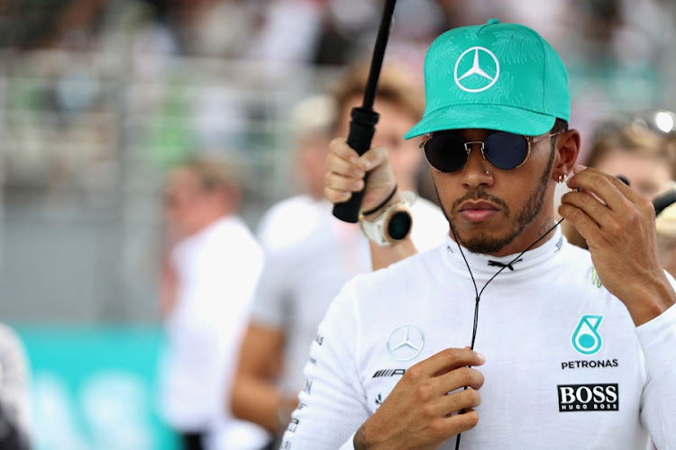 Lewis Hamilton of Great Britain and Mercedes GP prepares to drive on the grid before the Malaysia Formula One Grand Prix at Sepang Circuit on October 1, 2017 in Kuala Lumpur, Malaysia.