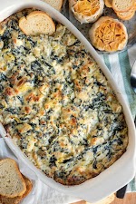 Spinach Artichoke Dip with Roasted Garlic was pinched from <a href="https://www.momontimeout.com/spinach-artichoke-dip-recipe/" target="_blank" rel="noopener">www.momontimeout.com.</a>