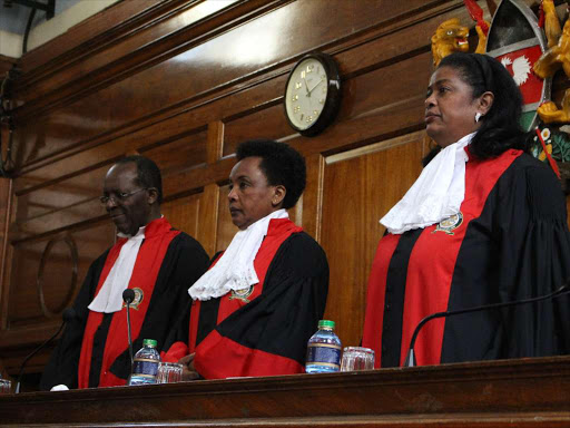 Deputy Chief Justice Philomena Mwilu (centre) together with fellow Judges Jackton Ojwang and Njoki Ndungu at the Supreme court on Thursday,December 14 when they made a judgement on death penalty and sent the petitioners case to the high court for rehearing of the sentence on priority basis. PHOTO/COLLINS KWEYU