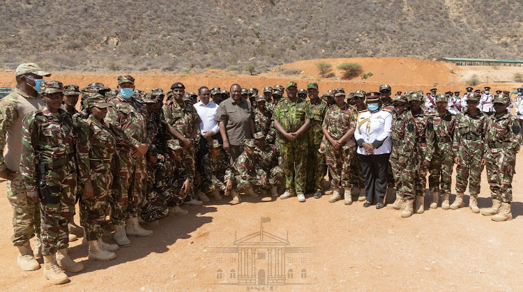 President Uhuru Kenyatta and some of the graduands after a training at Kamanga, Isiolo County, where he presided over the passing out parade of 256 Special Forces of the Administration Police, on July 14, 2022.