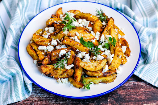 A platter of Cassie's Greek Fries on the Grill.