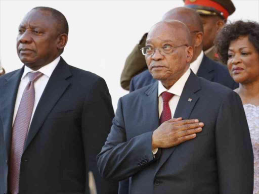 South Africa's President Cyril Ramaphosa and former President Jacob Zuma stand during a past event in Cape Town, February 11, 2016. /REUTERS