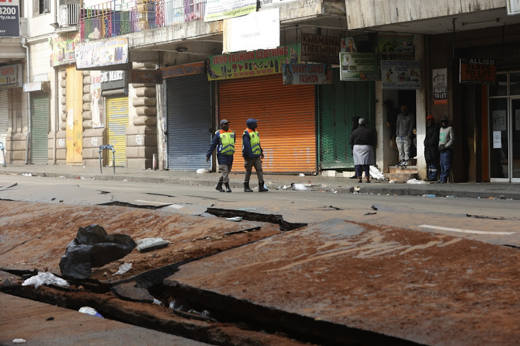 The damage on Bree street after yesterday's explosion in Johannesburg cbd damaging cars and taxis. One person has been confirmed dead.