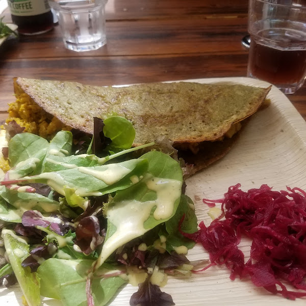 Dosa with cauliflower and potatoes, side salad and pickled onions.