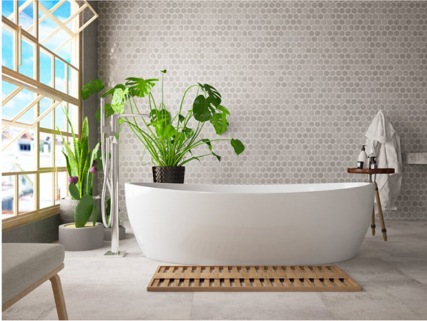 Stylish bathroom sanctuary with modern freestanding bathtub and greige hexagonal wall tiles