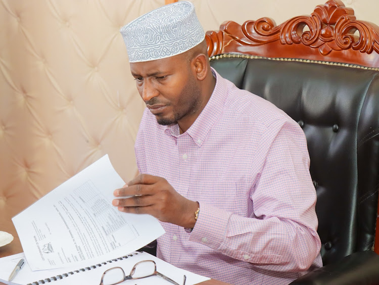 Wajir Governor Ahmed Abdullahi during a meeting with officials from the departments of Roads and Public Works and Trade and ICT on Monday.