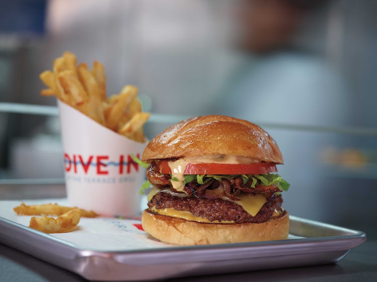 Try a Cannonball burger with fries at Dive-In at the Terrace Grill, offering alfresco dining by the pool on your Holland America ship.