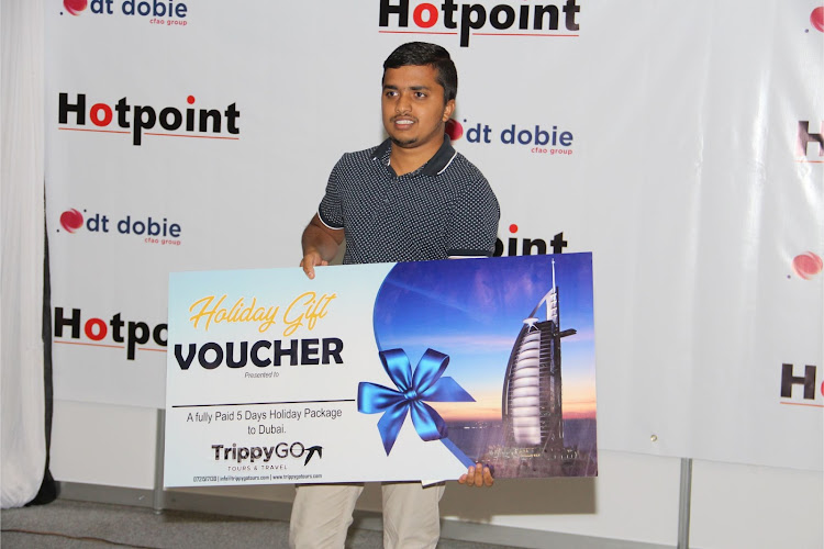 Neer Shah shows his voucher for holiday