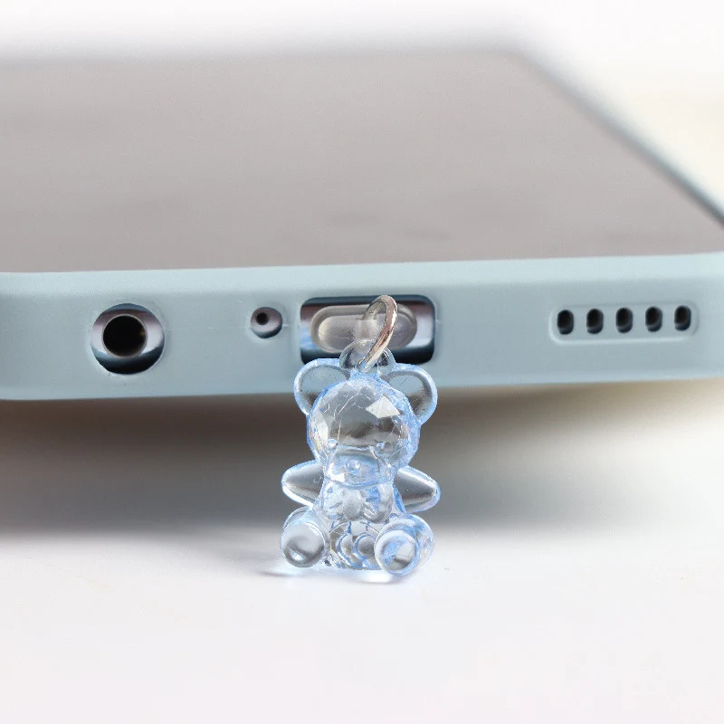 Plugue de poeira fofo para orifício de fone de ouvido com orelhas de urso de acrílico estéreo. Proteja seu celular com estilo e fofura!