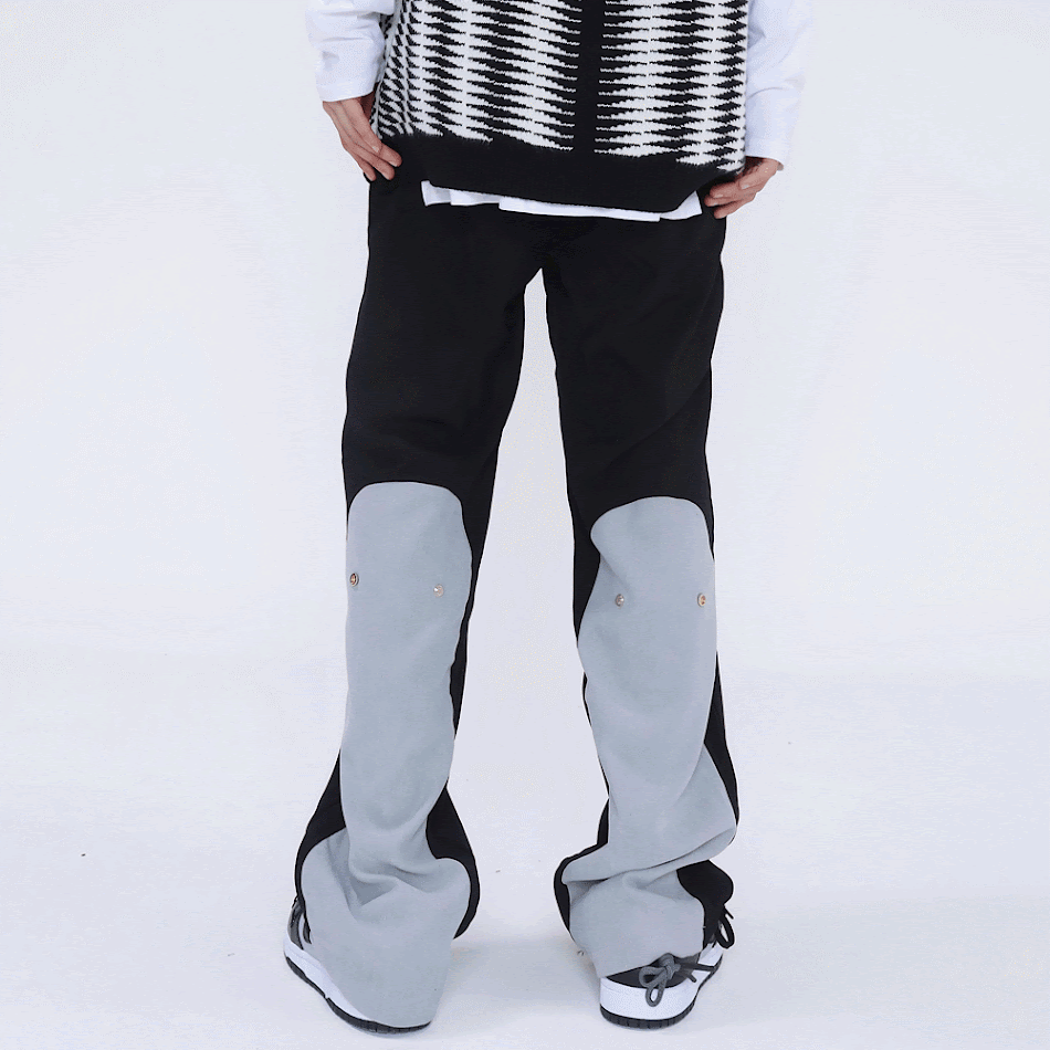 High Street Fashion bol paça düz pantolon, koyu renk trendi. Rahat kesim ve şık görünüm için ideal. Günlük kullanım için mükemmel.
