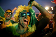 Brazilian soccer fans at the Fifa Fan Fest on Copacabana beach in Rio de Janeiro, Brazil during the 2014 World Cup. 