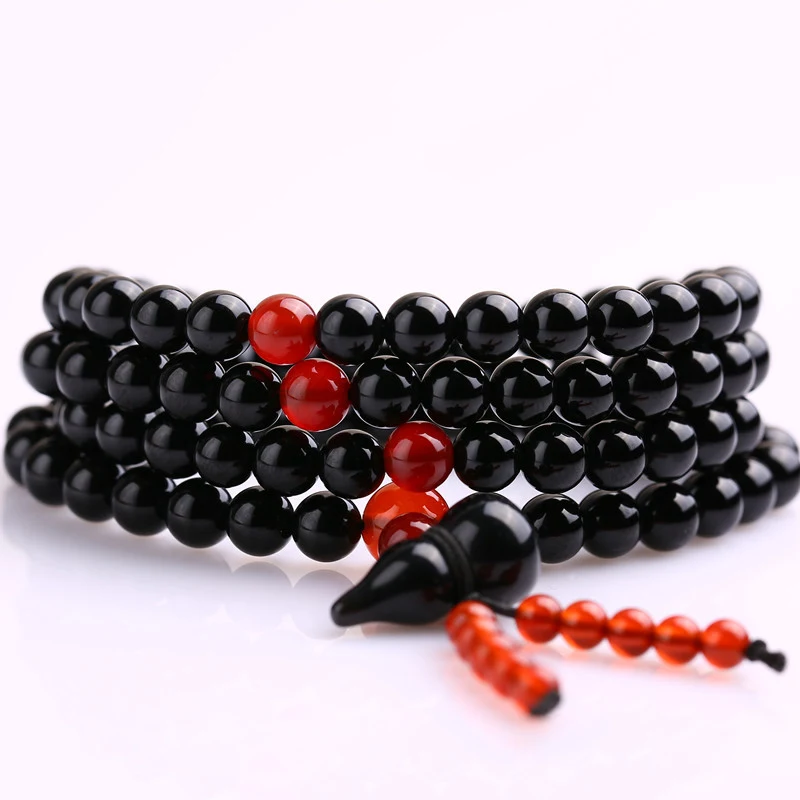Pulseira étnica de 108 contas de vidro preto, ideal para meditação e uso diário. Combine estilo e bem-estar.
