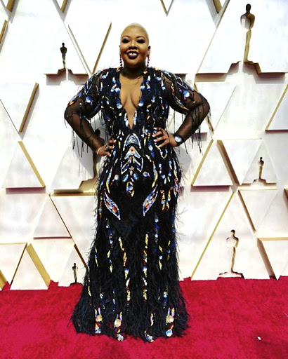 Anele Mdoda looking confident at the Academy Awards.