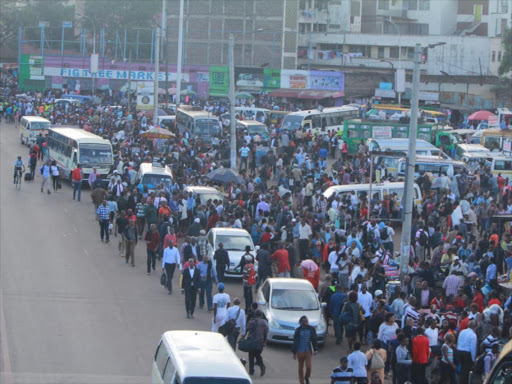 Commuters trek to town on Monday as the ban on matatus from accessing the CBD took effect. /COURTESY