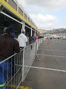 A line for liquor builds up slowly outside Makro Durban.