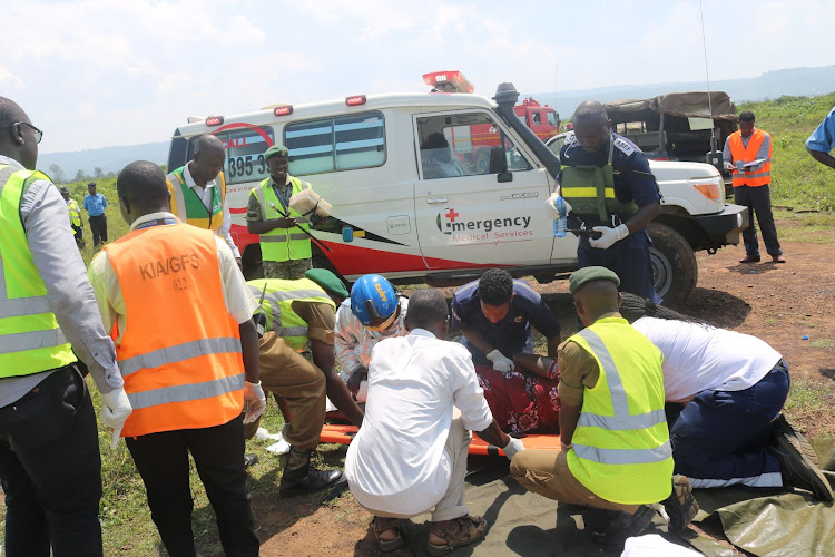 Kisumu International Airport emergency response team, attending to a 'victim' of the plane crash during the KAA emergency drill at Kisumu International Airport on Friday.