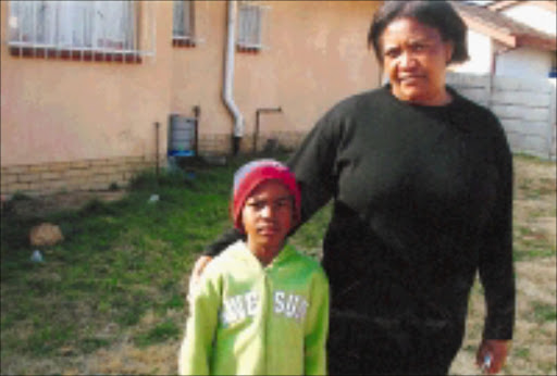 BROKEN PROMISES: Mine widow Masabata Nqandela with her youngest son Thami. 08/11/08. © Unknown.