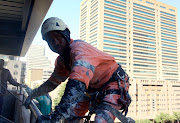 Jevis Melle‚ 22‚ is a rope-assist-technician for Rope Works‚ a firm that specialises in the external maintenance of high-rise buildings. 