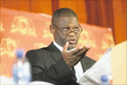 IT'S OVER: Acting national director of public prosecutions Mokotedi Mpshe announces the decision to drop corruption charges against ANC president Jacob Zuma at the NPA's headquarters in Pretoria. 06/04/09. Pic. Veli Nhlapo. © Sowetan.

INTERCEPTION: Acting national director of public prosecutions Mokotedi Mpshe last week announced that charges against ANC president Jacob Zuma had been dropped after taped telephone conversations between Scorpions bosses revealed interference in Zuma's prosecution. Business Day. 14/04/2009. Pg 03.