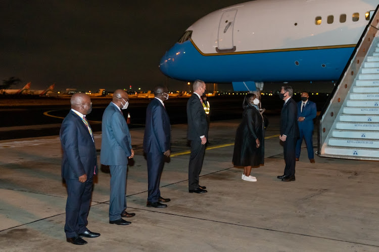 US Secretary of State Antony J Blinken being received by Foreign Affairs Cabinet Secretary Raychelle Omamo and US Embassy Chargé d'Affaires Eric Kneedler after arriving in Nairobi on November 17, 2021.