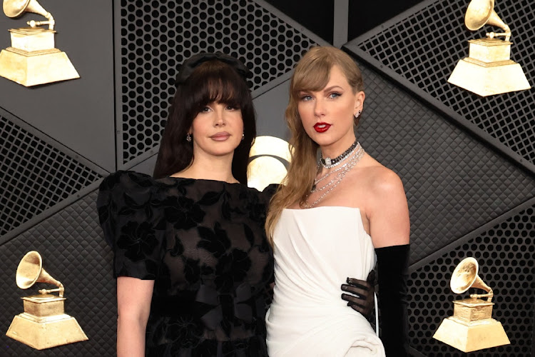 Lana Del Rey and Taylor Swift pose on the red carpet as they attend the 66th Annual Grammy Awards in Los Angeles, California, U.S.