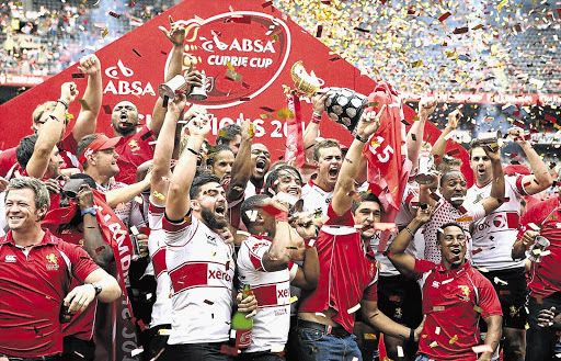 Golden Lions players celebrate after winning the 2015 Currie Cup final at Ellis Park.