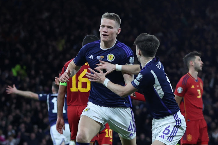 Scotland's Scott McTominay celebrates scoring their second goal with teammate Kieran Tierney in the Euro 2024 Group A qualifier against Scotland at Hampden Park in Glasgow on March 28 2023.