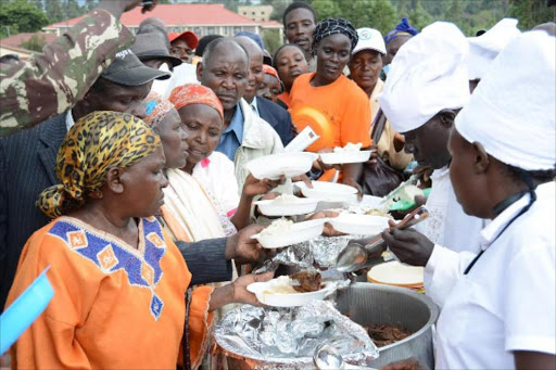 Farmers are served with fish during the launch of ‘Eat More Fish’ campaign at Nyamache Green Stadium in Bobasi subcounty.