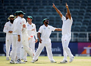 South Africa's Vernon Philander celebrates bowling out Australia's Chad Sayers with team mates.