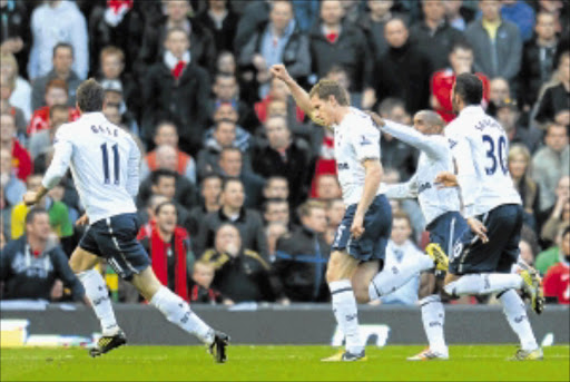 Victory: Jan Vertonghen of Tottenham Hotspur, centre, celebrates scoring the opening goal. PHOTO: Getty Images