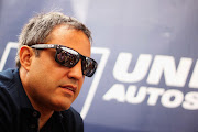 Juan Pablo Montoya of Colombia and the United Autosports team is interviewed by the media during previews to the Le Mans 24 Hour race at the Circuit de la Sarthe on June 15, 2018 in Le Mans, France. 