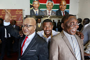 Lungelo Gumede with his sculptures of Jacob Zuma and Cyril Ramaphosa.