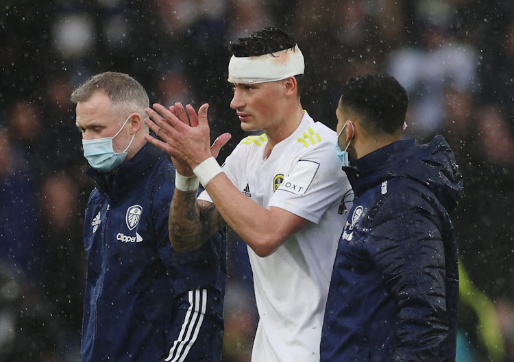 Leeds United's Robin Koch applauds the fans as he is substituted off after sustaining an injury against Manchester United