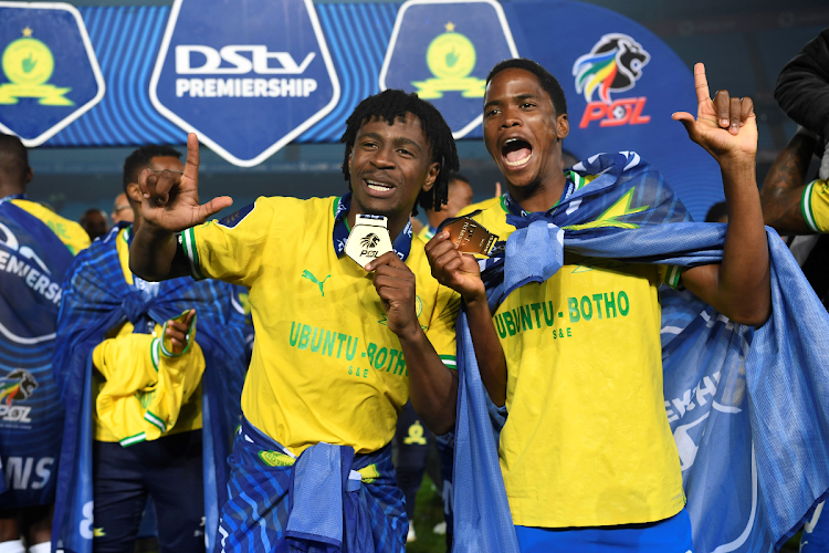 Mamelodi Sundowns players Terrence Mashego (left) and Sifiso Ngobeni, who has joined AmaZulu FC, celebrate winning DStv Premiership at Loftus Versfeld Stadium on May 16, 2023.