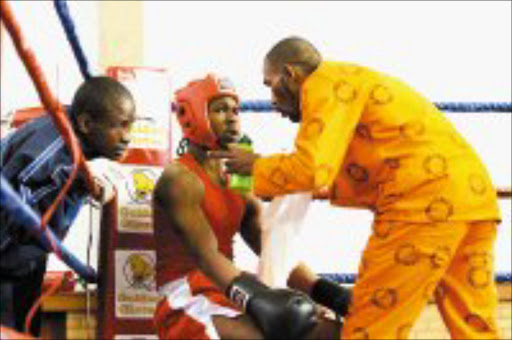 FEROCIOUS: Inmatesfrom Zonderware, Leeukop, Baviaanspoort and Boksburg prisons took part in a boxing tournment. Pic. Thobeka Zazi Ndabula.05/07/2007. © Sowetan.