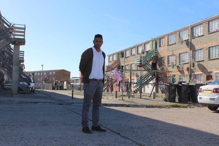 Dominique Caswell stands outside the blocks of flats in Lavender Hill where he often is called to meet with clients.