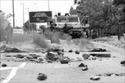 STREETS AFLAME: This is Khutsong, now in the throes of a violent and often bloody civil war. Pic. Lucky Nxumalo. © Sowetan.