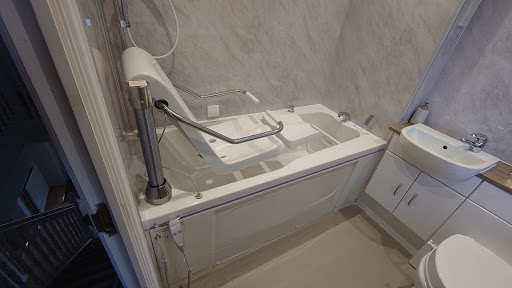Bath with powered seat installed