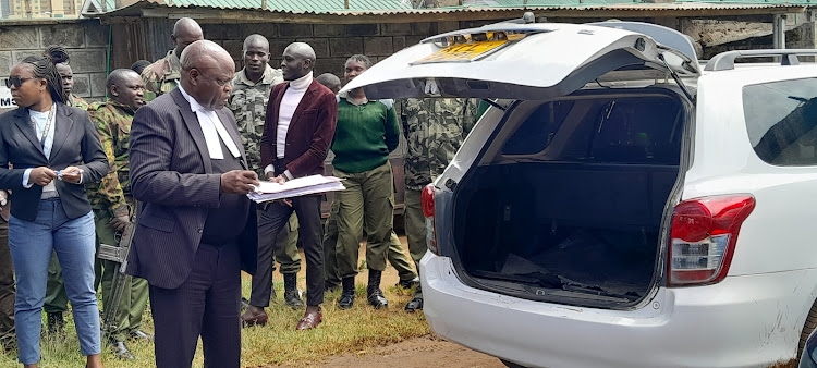 Justice Reuben Nyakundi inspects the car in which former LQBTQ activist Edwin Chiloba's body was ferried before being dumped in Eldoret in January this year