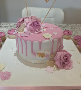70th pink drip cake