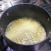 Thumbnail For Water, Sugar, And Lemon Zest Boiling In A Saucepan.