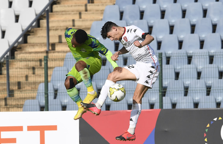 Monde Mphambaniso of Marumo Gallants is challenged by Haithem Loucif of USM Alger in the Caf Confederation Cup match at Dobsonville Stadium in Johannesburg on March 8 2023.