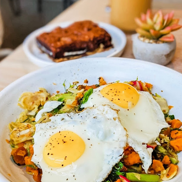 Plant-based hash with two sunny side up eggs is a GF go-to.