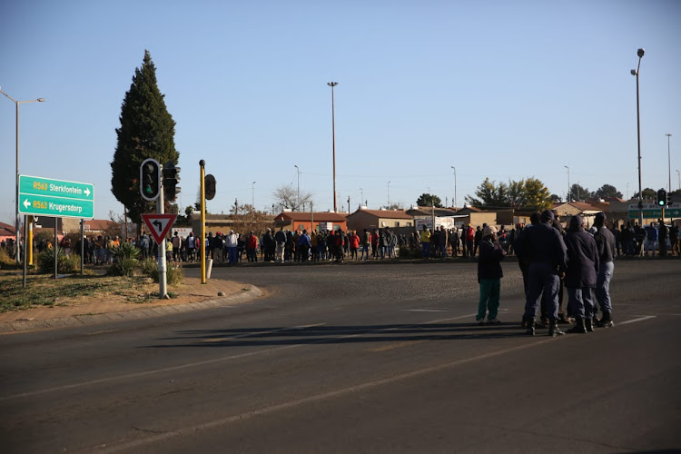 Police are on the scene to prevent an escalation of violence.