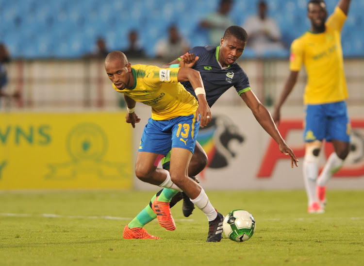 Tiyani Mabunda of Mamelodi Sundowns is challenged by Bonginkosi Ntuli of Platinum Stars during a Absa Premiership match at Loftus Versfeld Stadium in Pretoria South Africa on January 20 2018.