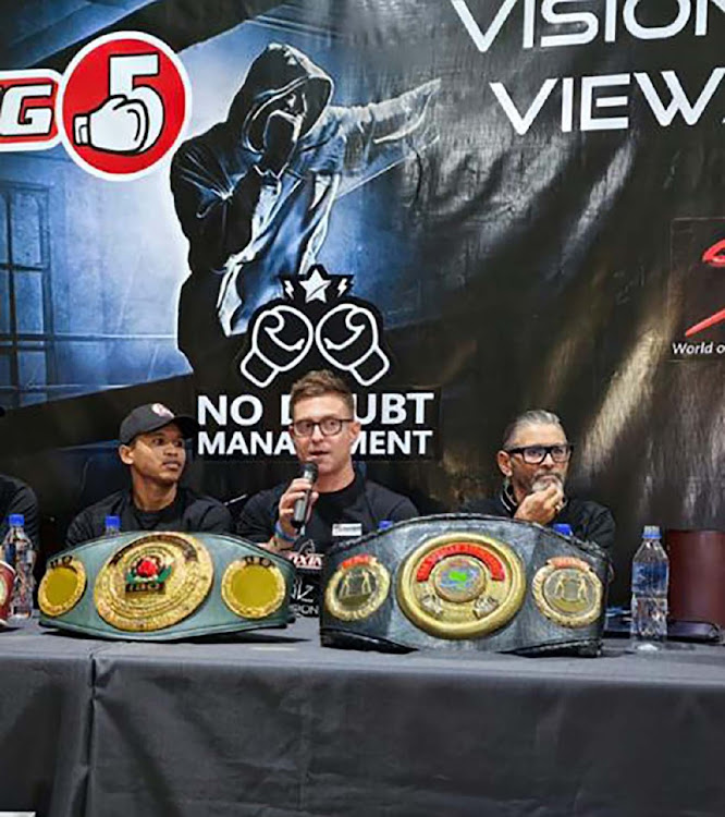 Ludumo Lamati, left. trainer Colin Nathan and promoter Larry Wainstein during a media briefing on Tuesday.