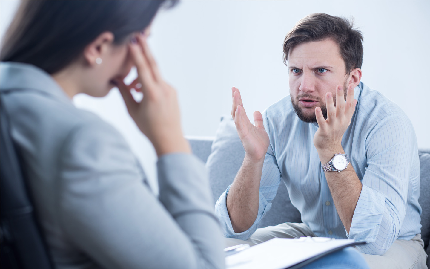 Types of Landlords to avoid: man complaining with woman holding head 