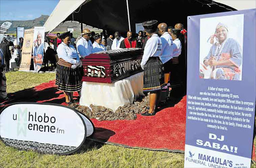 PAYING TRIBUTE: Mourners gather around Saba Mbixane’s casket at his funeral held near Mount Frere over the weekend Picture: LOYISO MPALANTSHANE