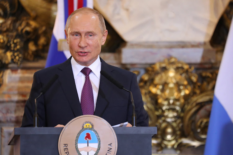 Russia's President Vladimir Putin speaks during a news conference with Argentina's President Mauricio Macri at the Casa Rosada Presidential Palace in Buenos Aires, Argentina, on December 1 2018.