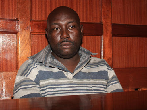 Police imposter Joshua Waiganjo Joshua Wainganjo at the Milimani law court..Phlip Kamakya